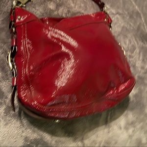 Coach red leather purse , modicum size.